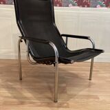 Pair of black leather reclining relaxation armchairs, "Hans Eichenberger" design, 19