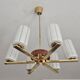 Lustre Mid Century Modern with 6 brass arms, teak, and frosted glass.