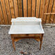 Wood and marble bathroom cabinet