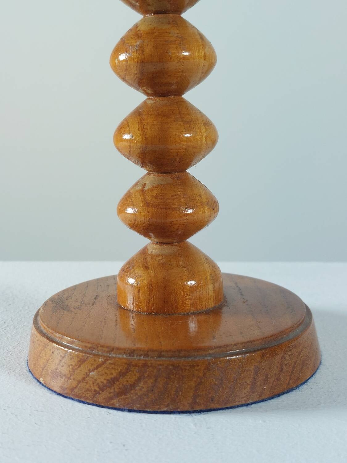 Vintage mid-century wooden candlestick, spool decoration from the 1970s.
