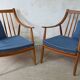 Pair of cozy teak armchairs with cushions