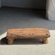 Small stool, footrest in blond teak, organic monoxyle with cut corners.