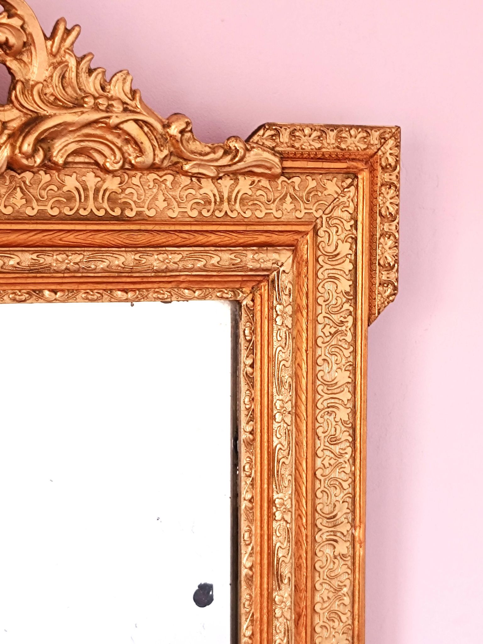 Napoleon III mirror with rich gilded ornamentation