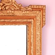 Napoleon III mirror with rich gilded ornamentation