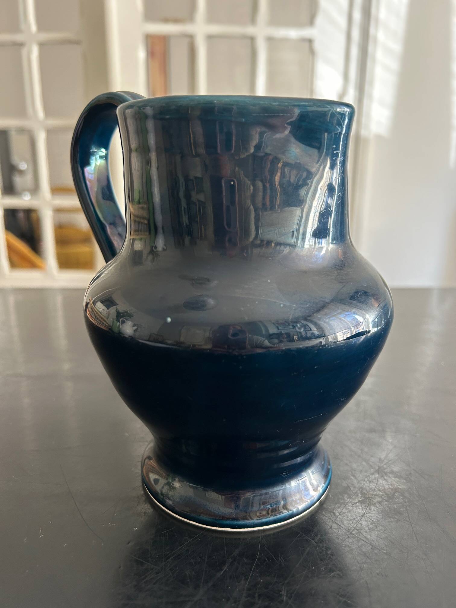 blue pitcher the potter chin