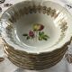 Lot de 8 coupelles porcelaine, décors fleurs et dorés
