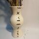 Vase is decorated in white clay;han mad