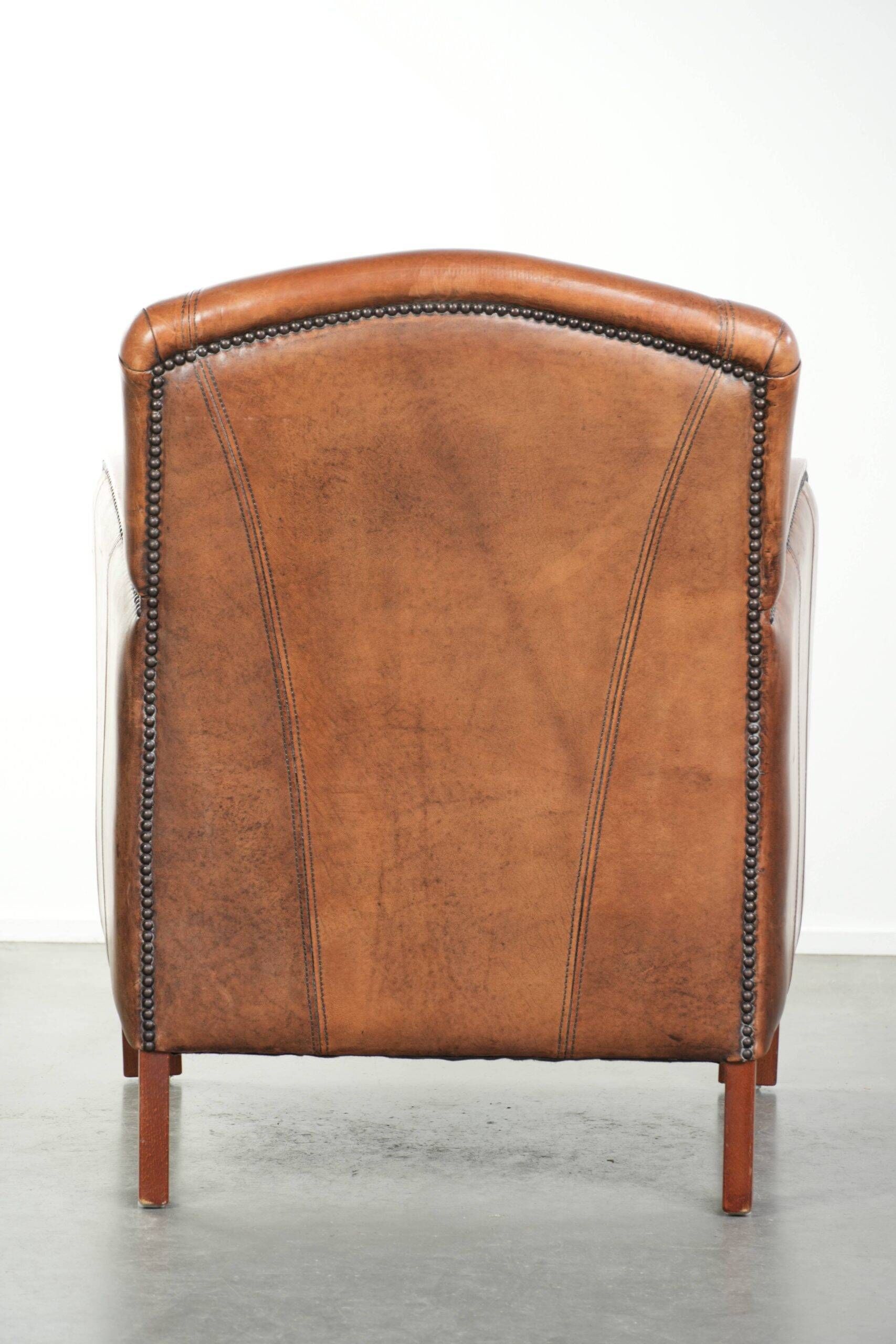 Sheepskin armchair in Art Deco style with wooden armrests