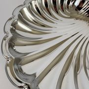 Large silver-plated serving dish in the shape of a vintage shell.