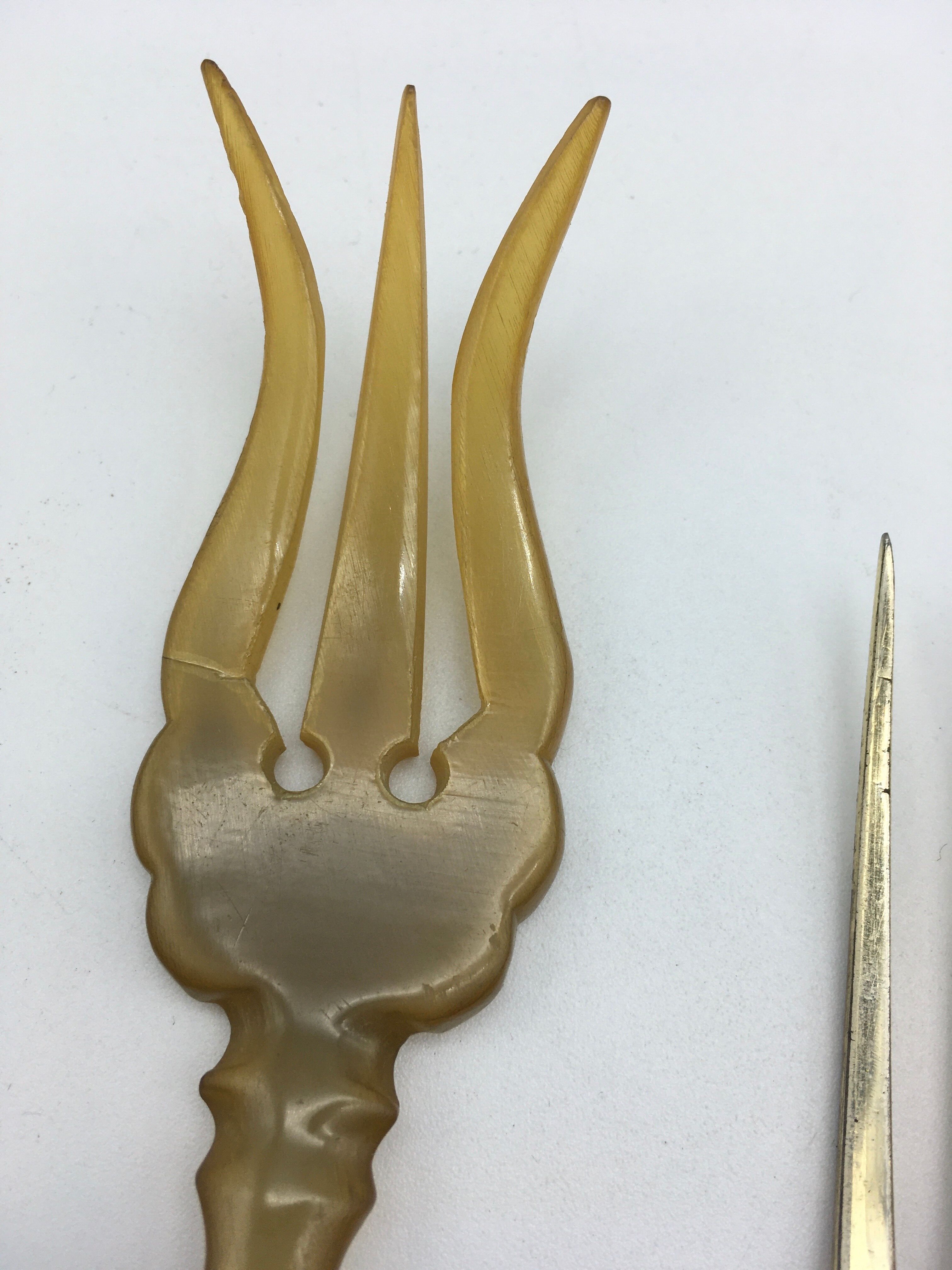 Box of filled silver salad cutlery