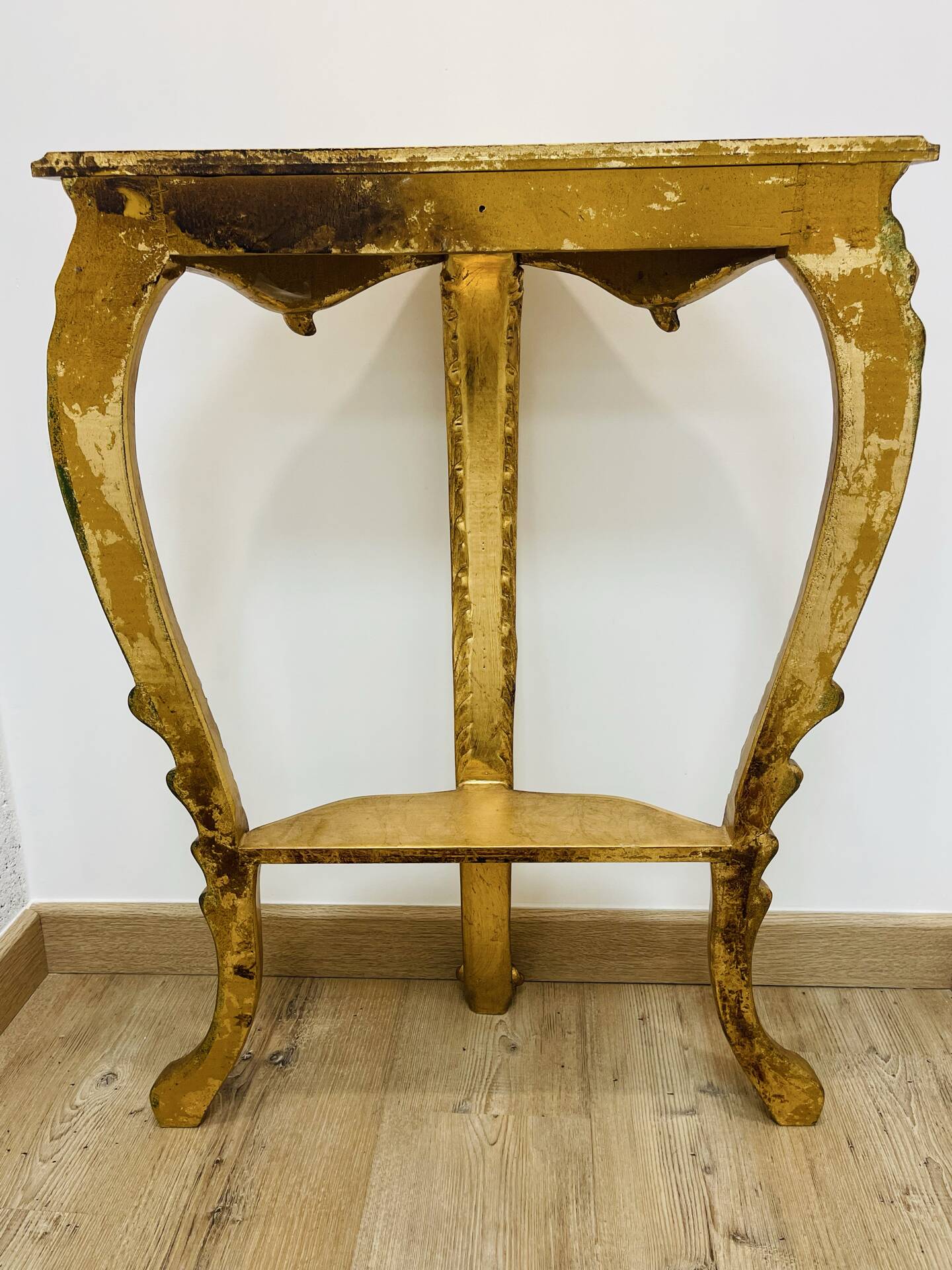 Golden console in Louis XV Rococo style made of resin.