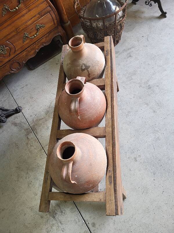 Old wooden jar holder with 3 clay jars