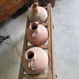 Old wooden jar holder with 3 clay jars