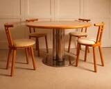 Circular dining table