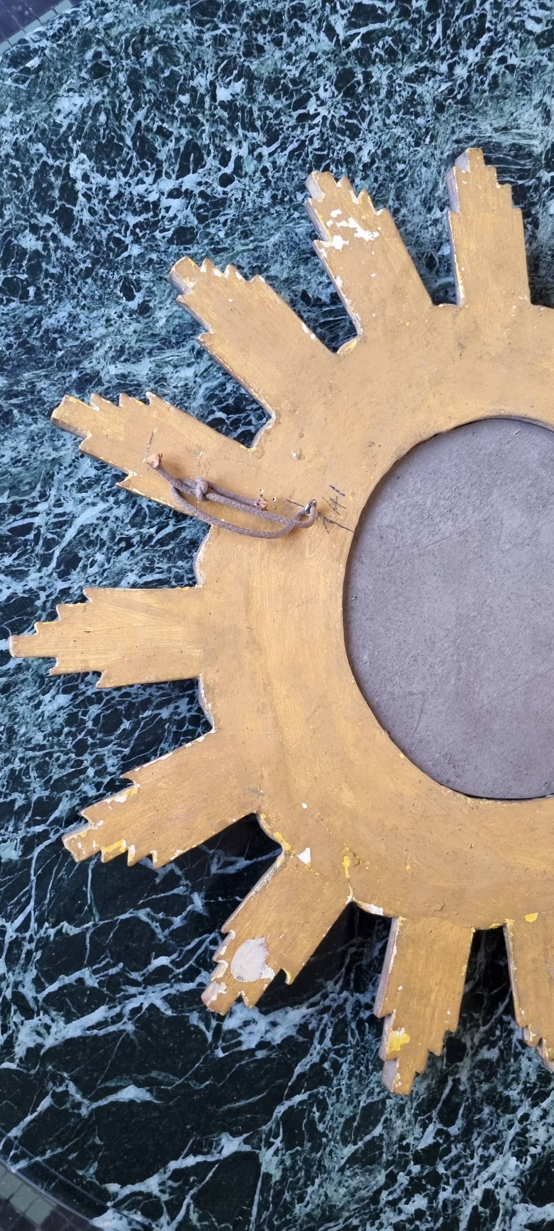 Vintage wooden and gold sun mirror