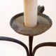Wrought iron tripod floor lamp decorated with stylized animal heads
