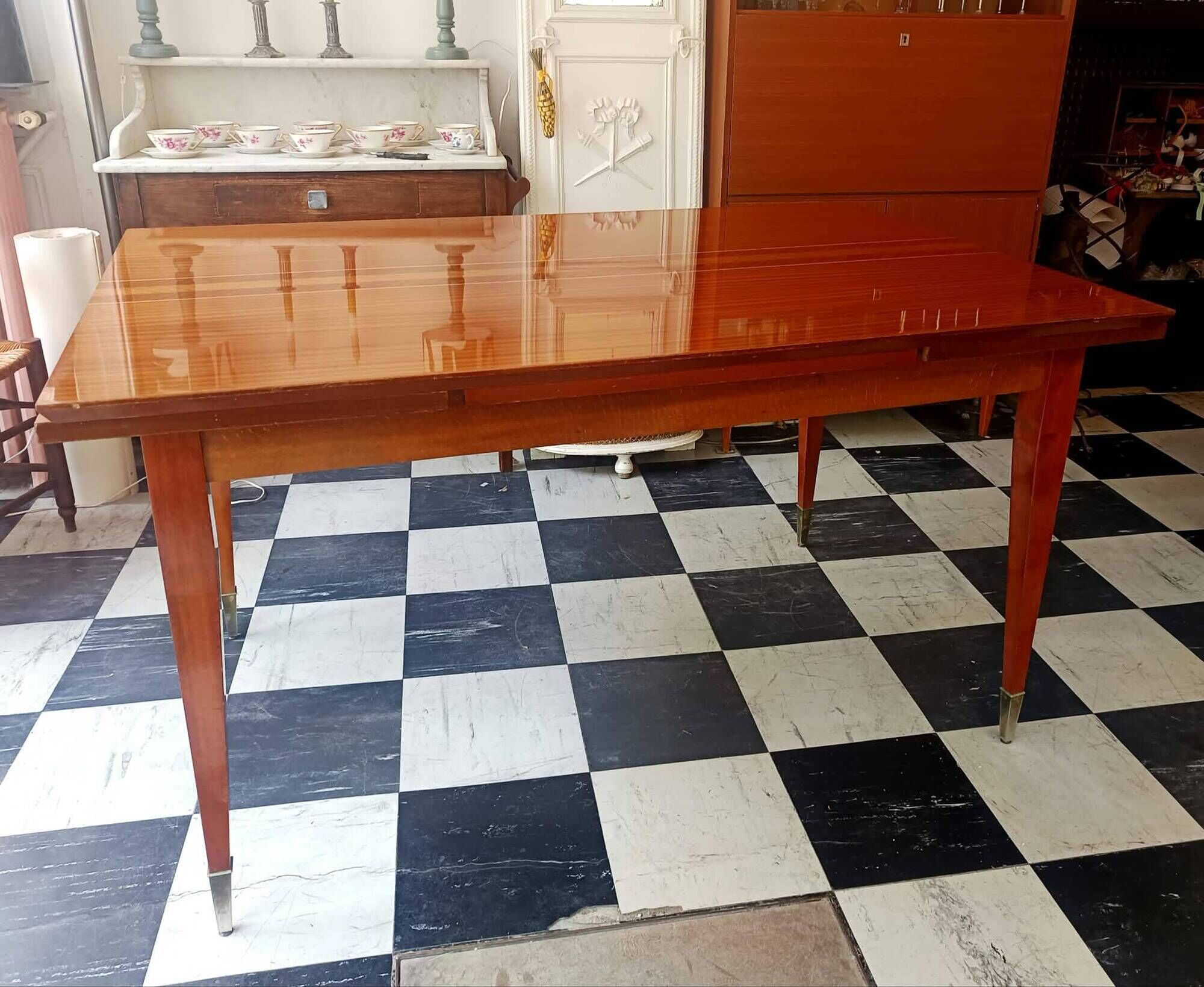 Mid-century vintage coffee table with tapered legs.