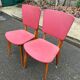2 Scandinavian chairs in solid wood and burgundy leather from the 1970s.