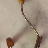 2 mismatched steel and wood coat hooks