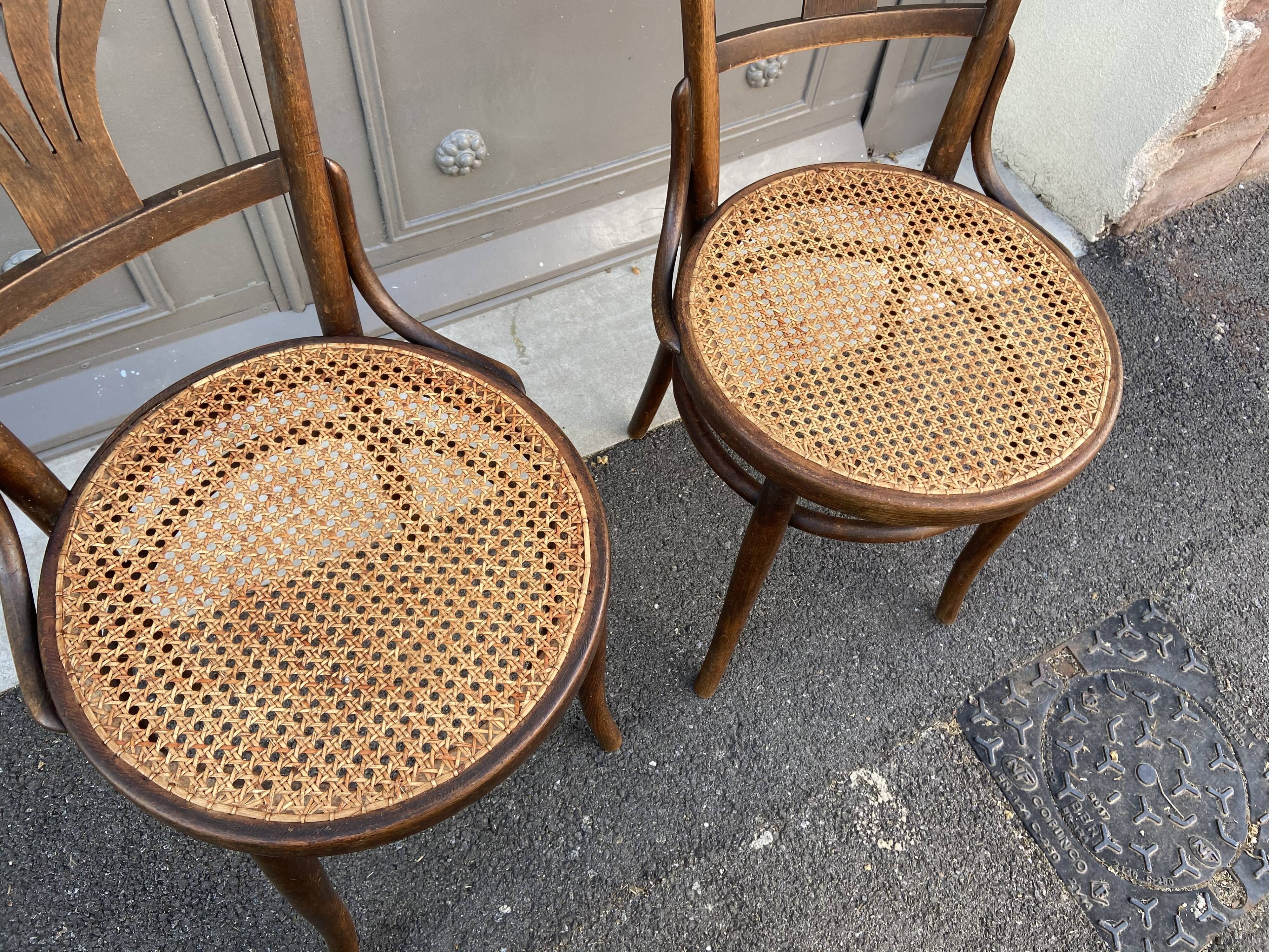 Pair of curved wooden bistro chairs