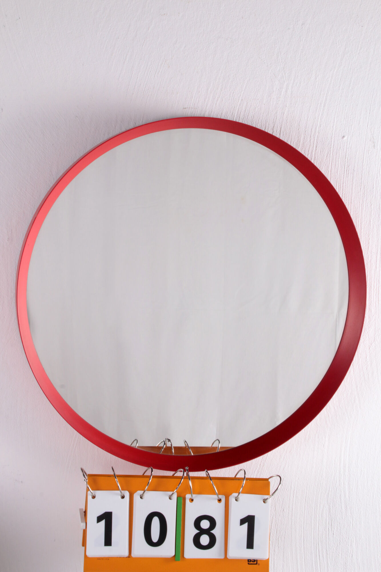 Vintage red round plastic mirror from the 1960s.