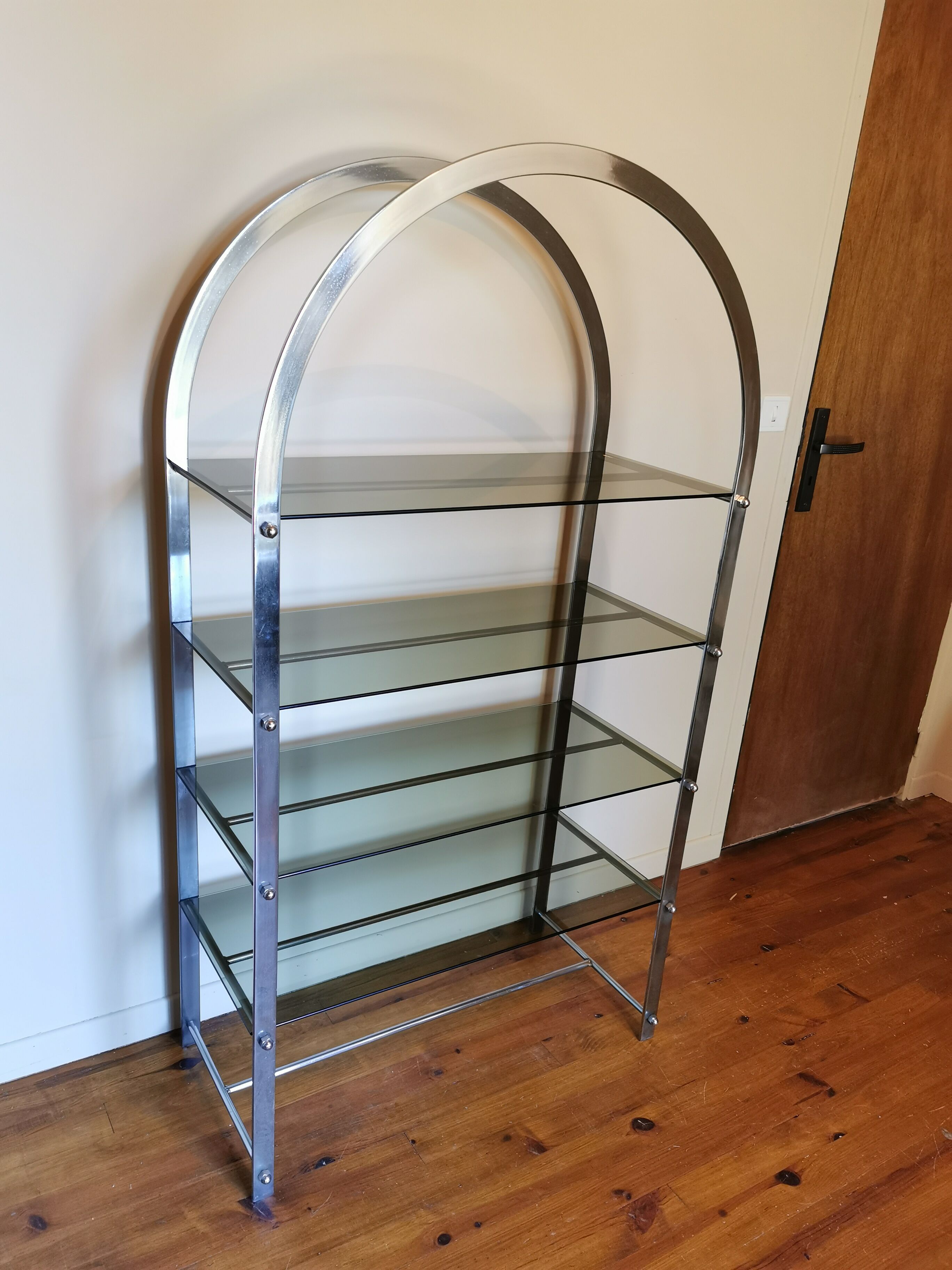 Rounded shelf from the 70s in chrome metal and glass