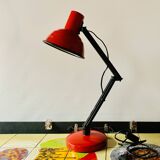 Old articulated desk lamp in red metal