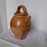 Old enameled ceramic pitcher