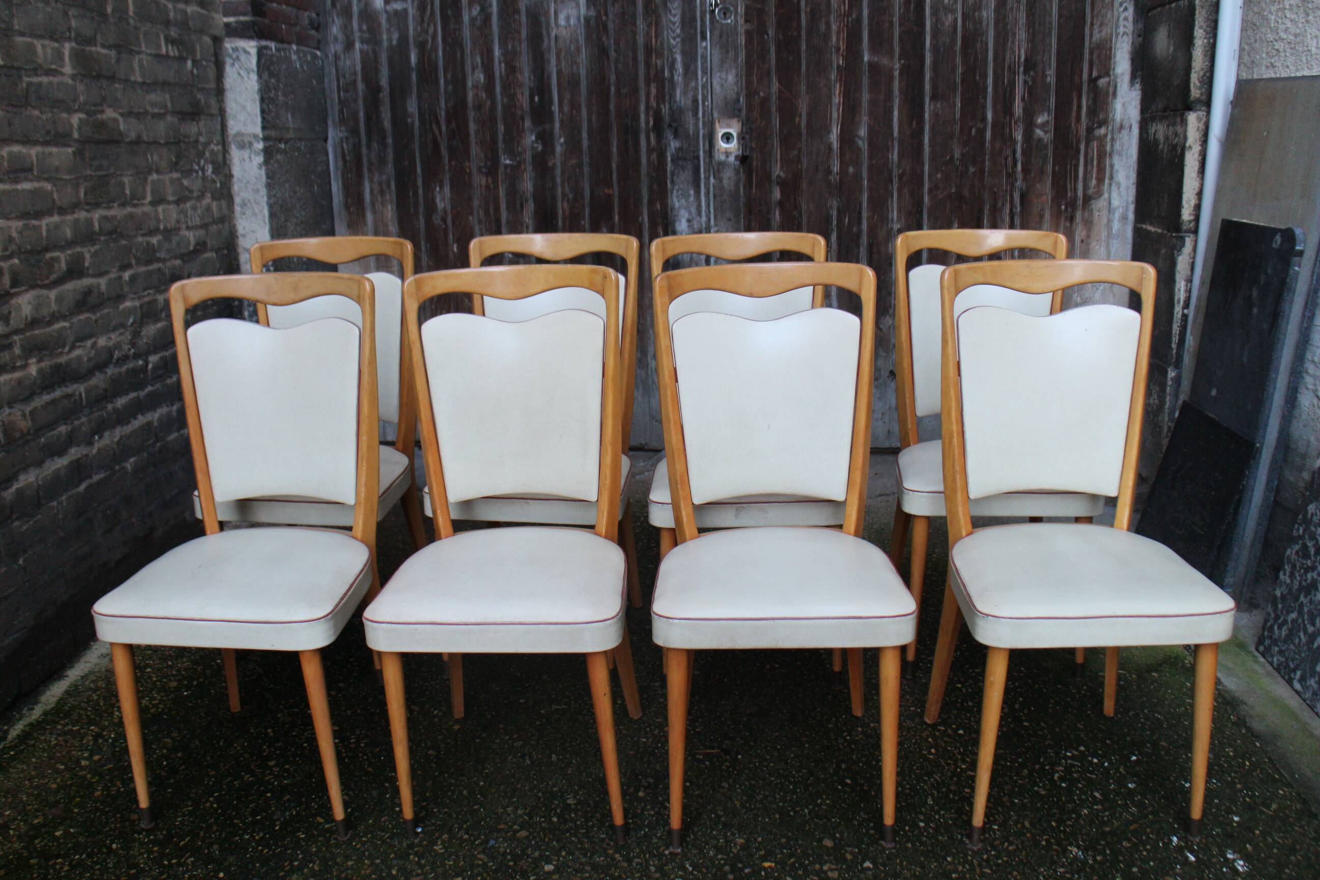 series of 8 vintage skai and wood chairs