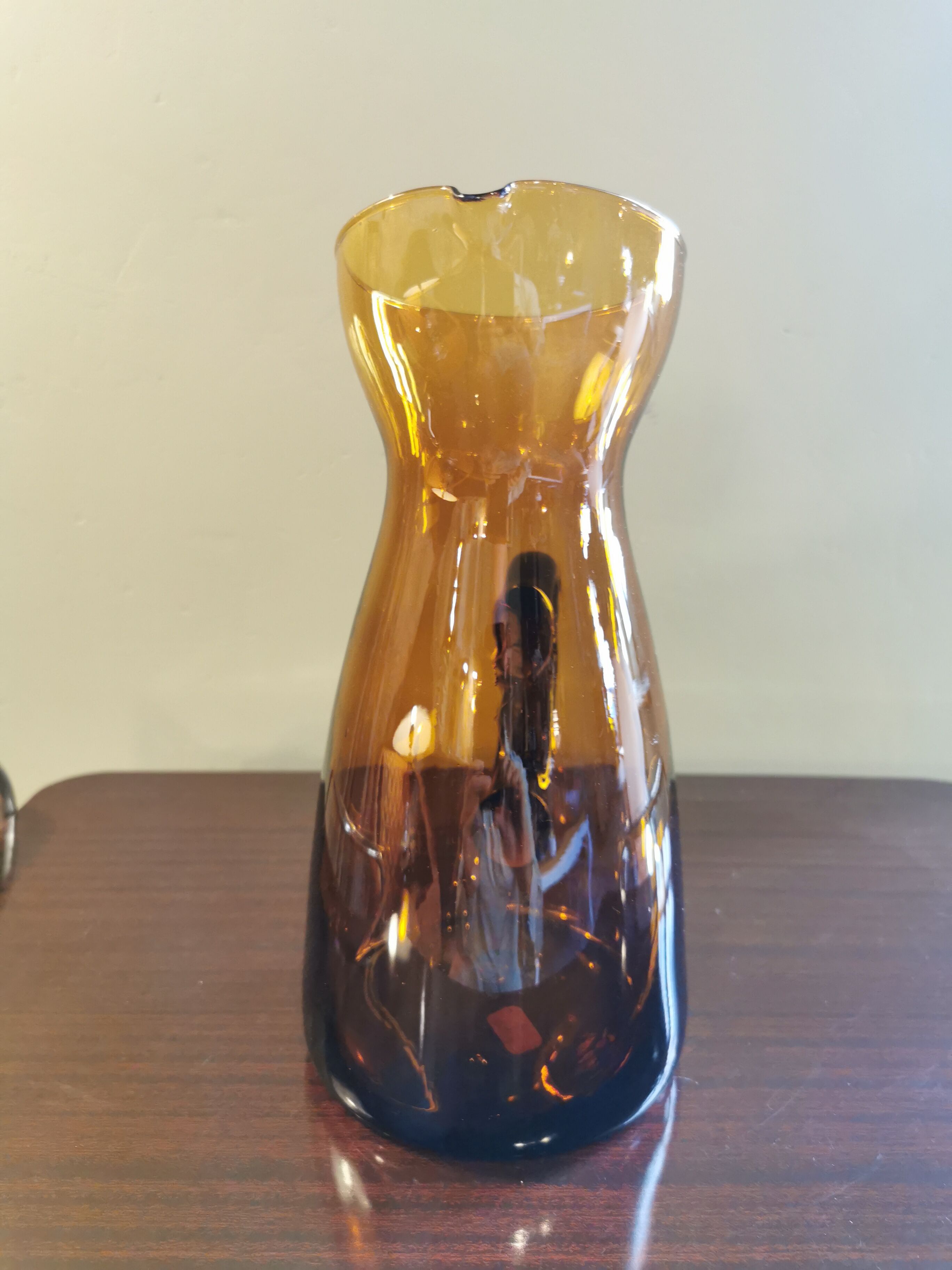 Vintage pitcher in amber glass