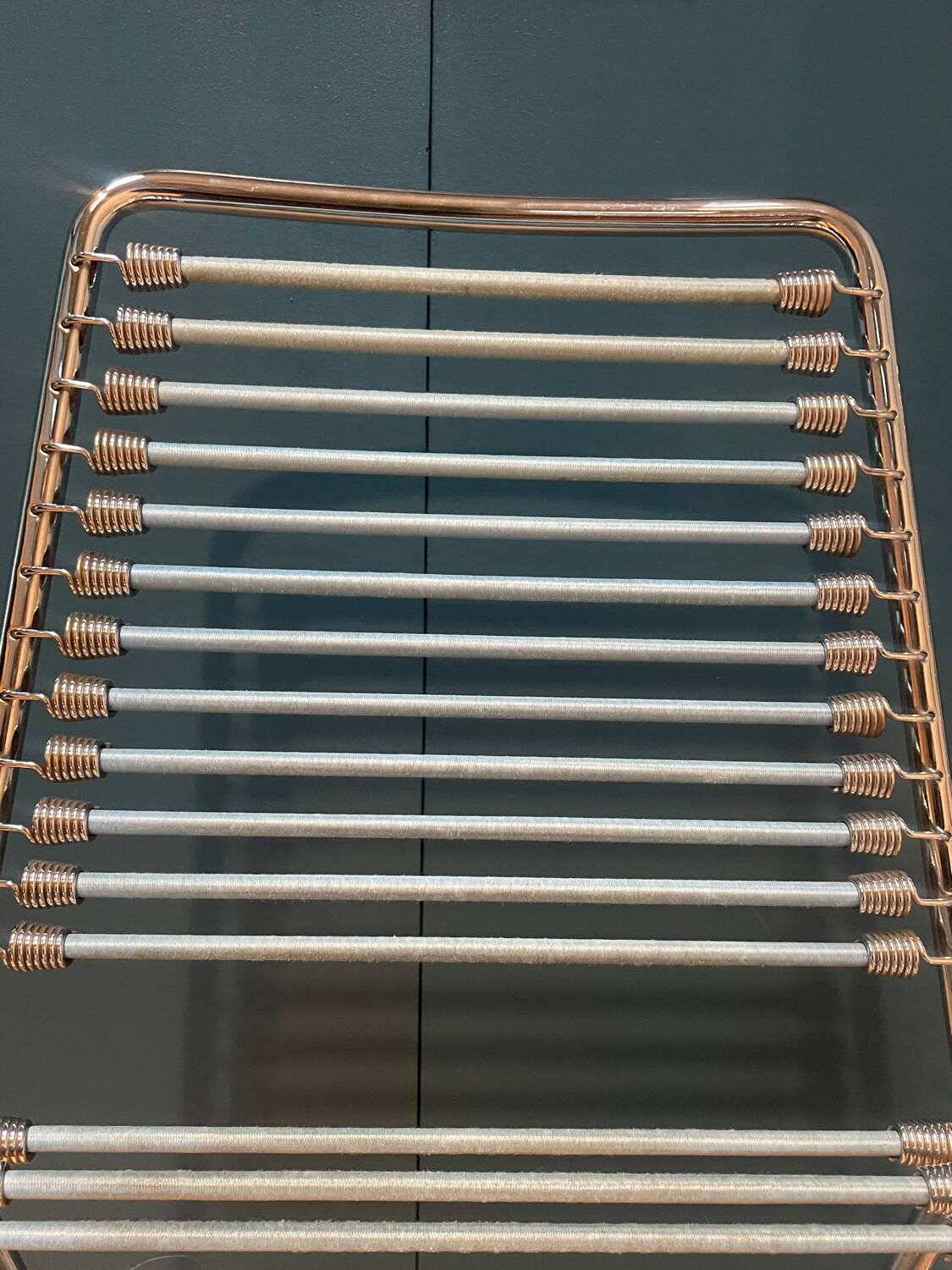 2 metal chairs with bungee cords