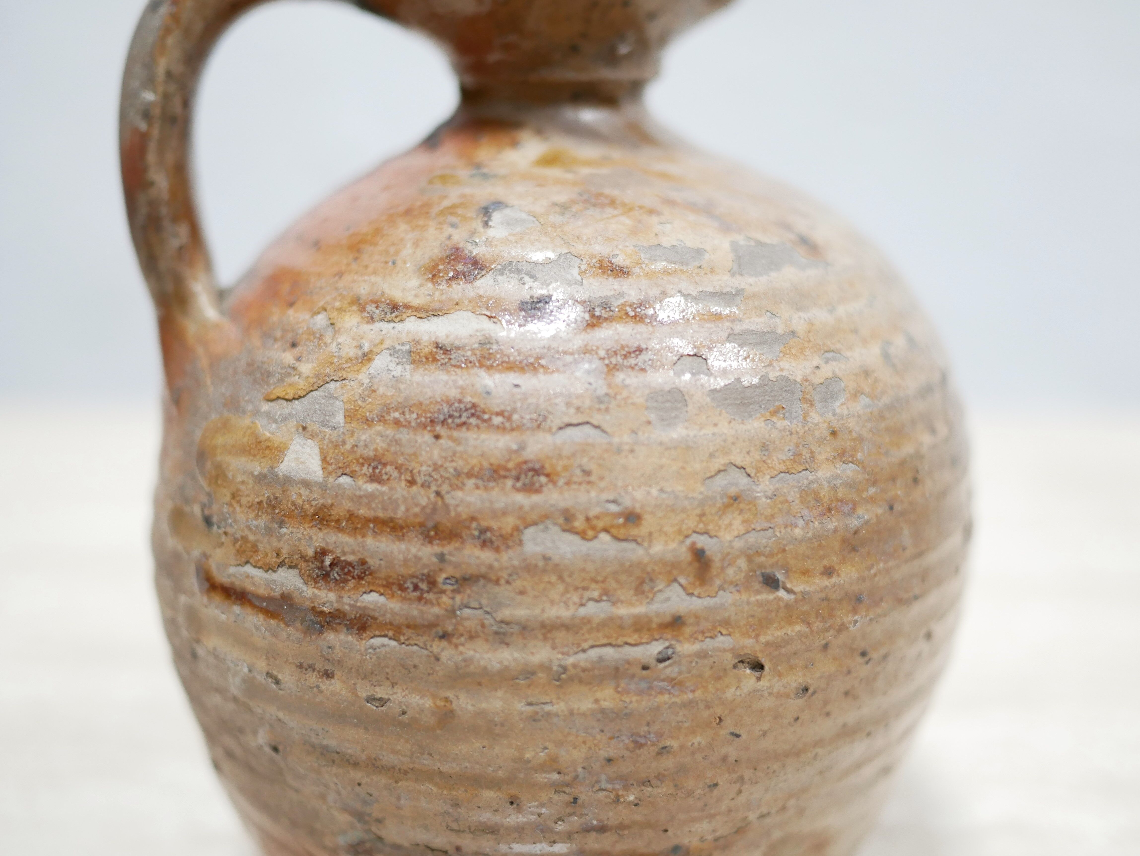 Old glazed terracotta jar