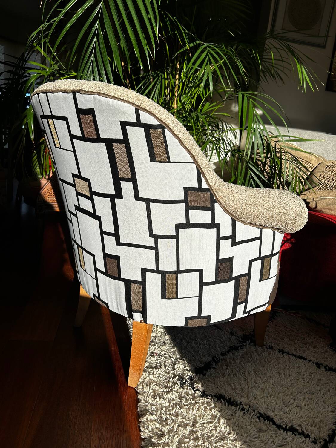 Fully restored beige and graphic armchair.