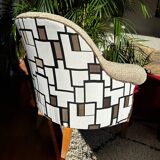 Fully restored beige and graphic armchair.