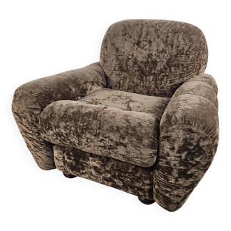 Fauteuil vintage tapissé de tissu