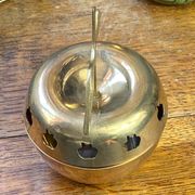 Bonbonnière, in the shape of an apple, made of brass.