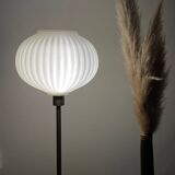 Table lamp with a white striped globe, origami style and a golden foot