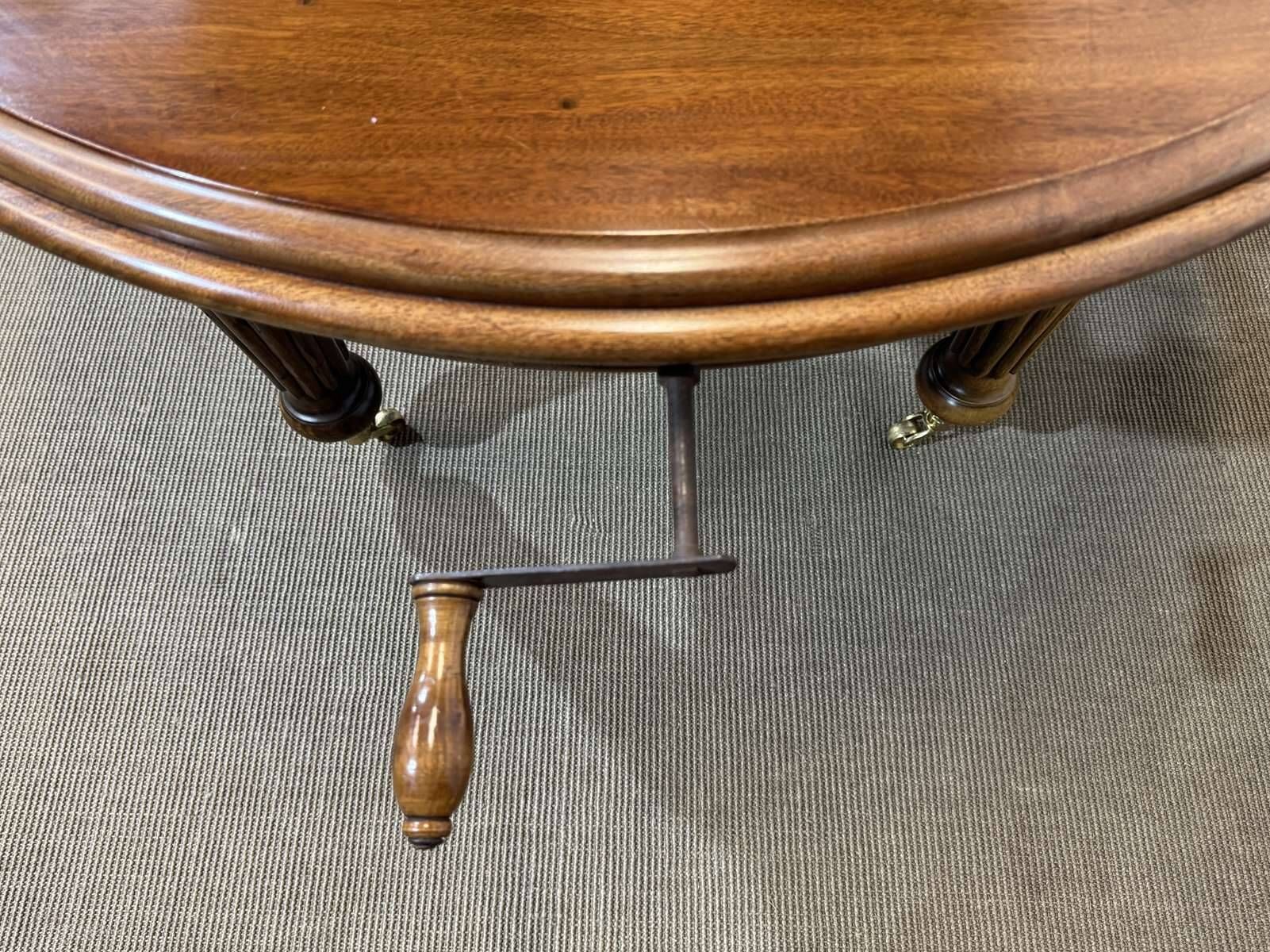 Victorian style oval mahogany table with 1 extension.