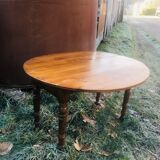 Extendable round table in walnut wood 1930