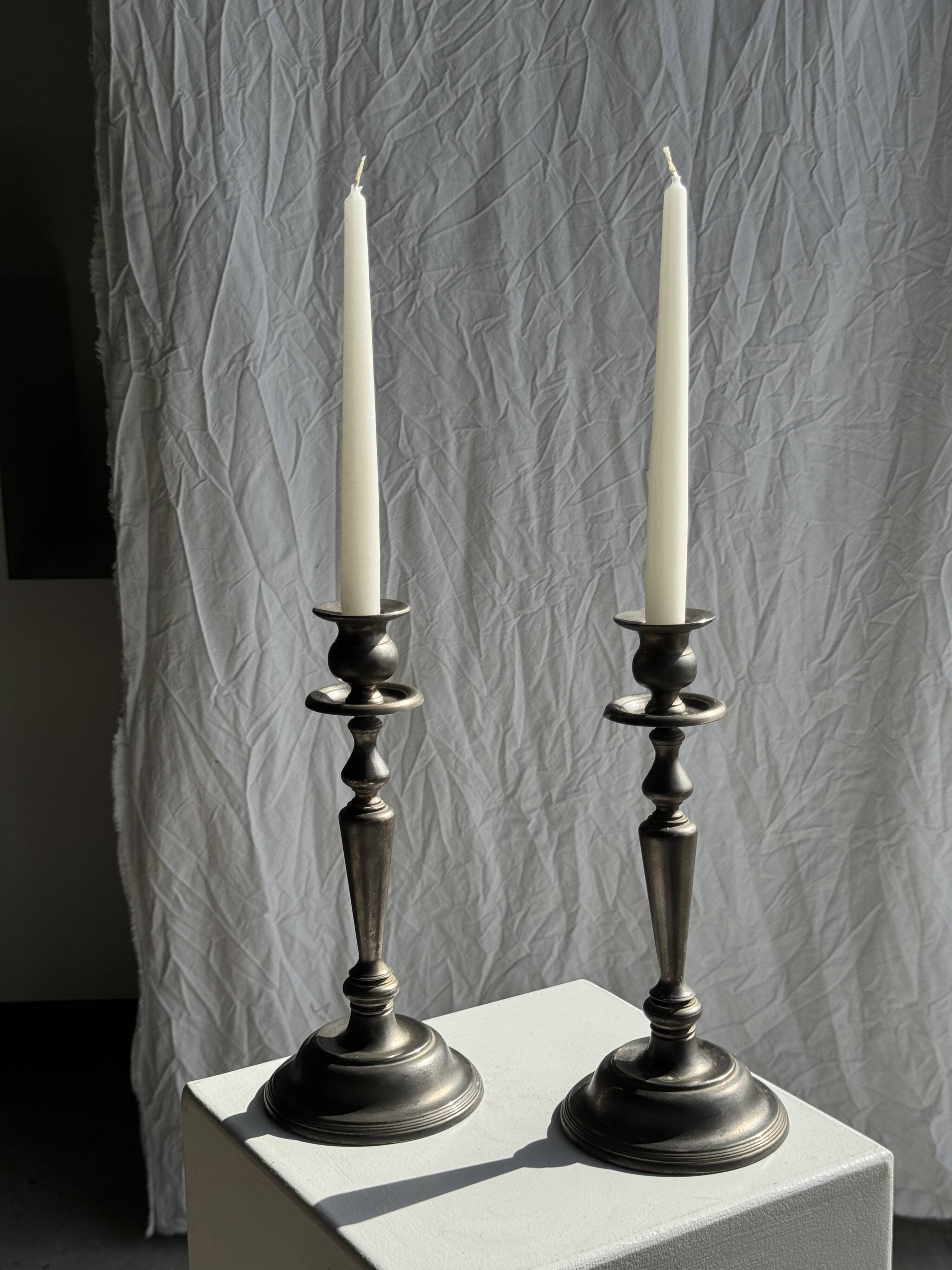 Two large antique silver-plated metal candlesticks, H30
