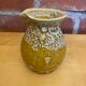Pichet ancien cyclope style charles cart céramique fat lava jaune vint