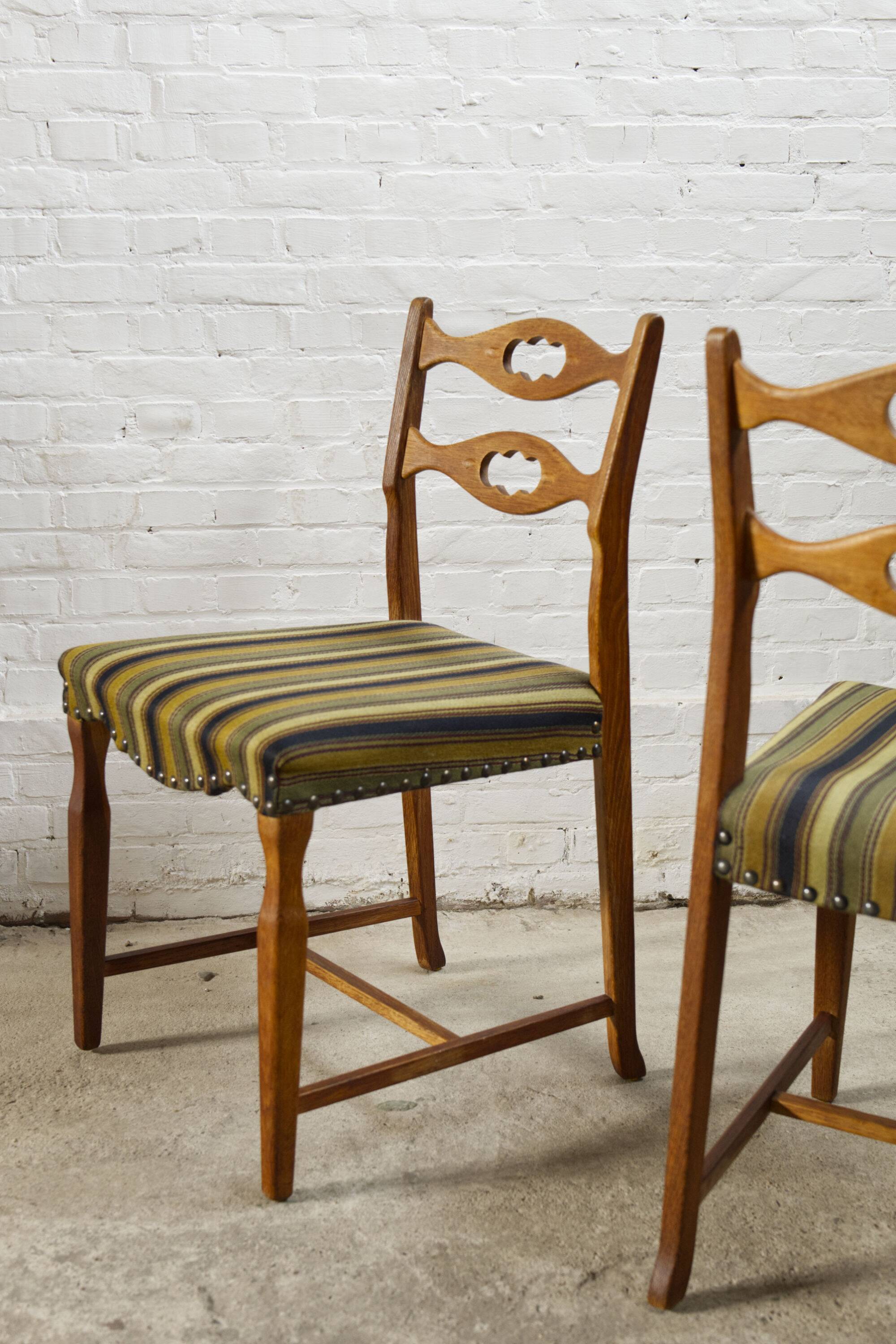 Set of four oak and wool dining room chairs by Henning Kjaernulf, 1960's