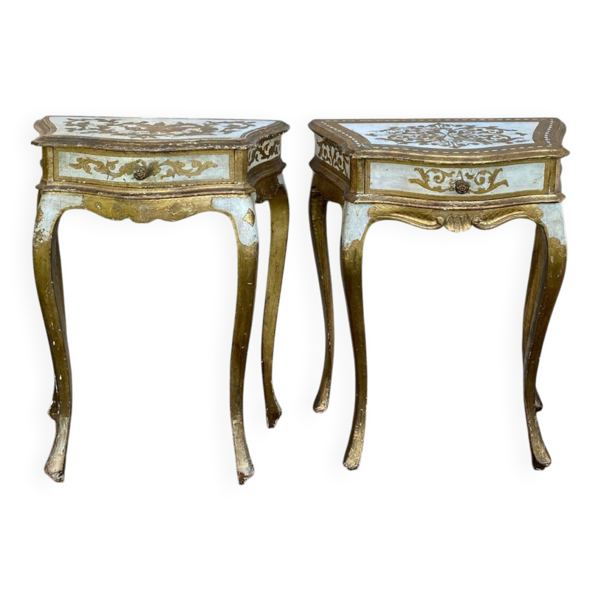 Pairs of Florentine bedside tables in gilded wood.