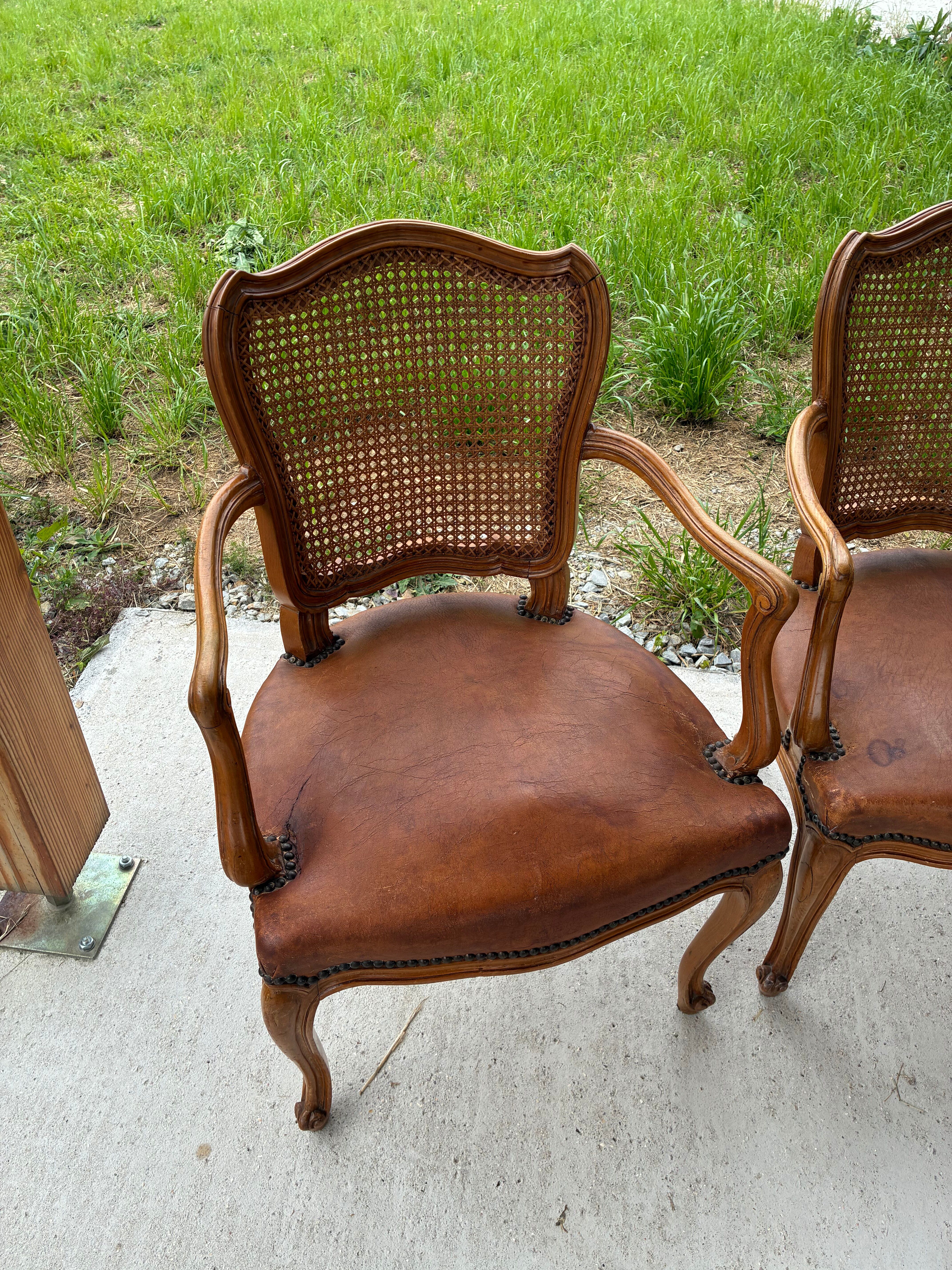Cane and leather armchair in Louis XV style