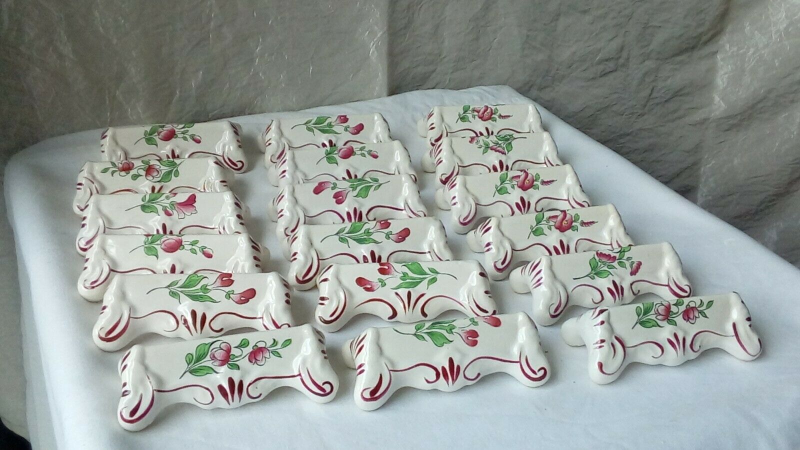 Suite of 18 knife holders in faience of luneville model reverbere