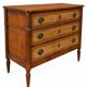 Light walnut commode in Louis XVI style with fluted motifs and three drawers.