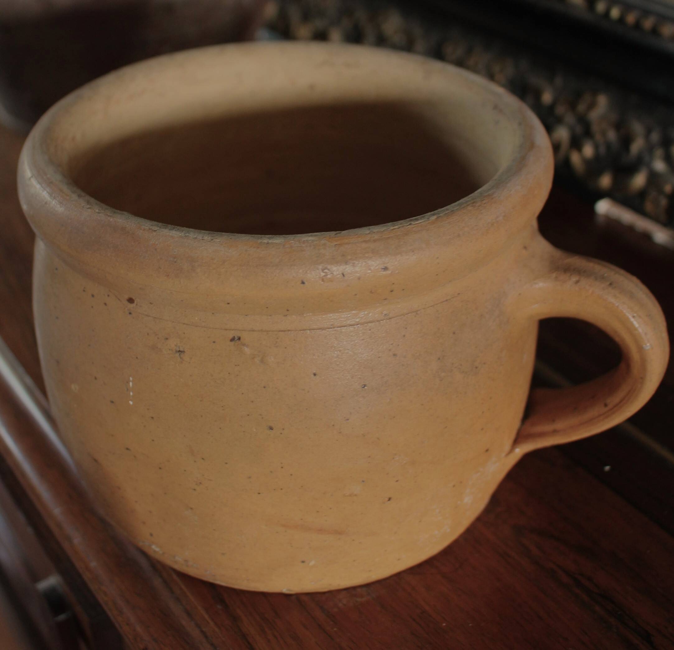 Round terracotta milk jug with handle