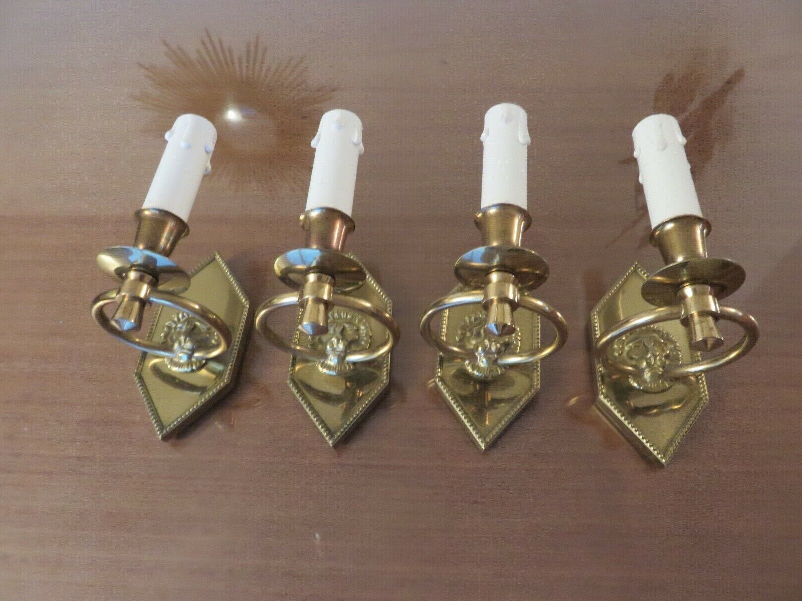 Series of 4 art deco sconces to lions in solid golden brass 40s 50s