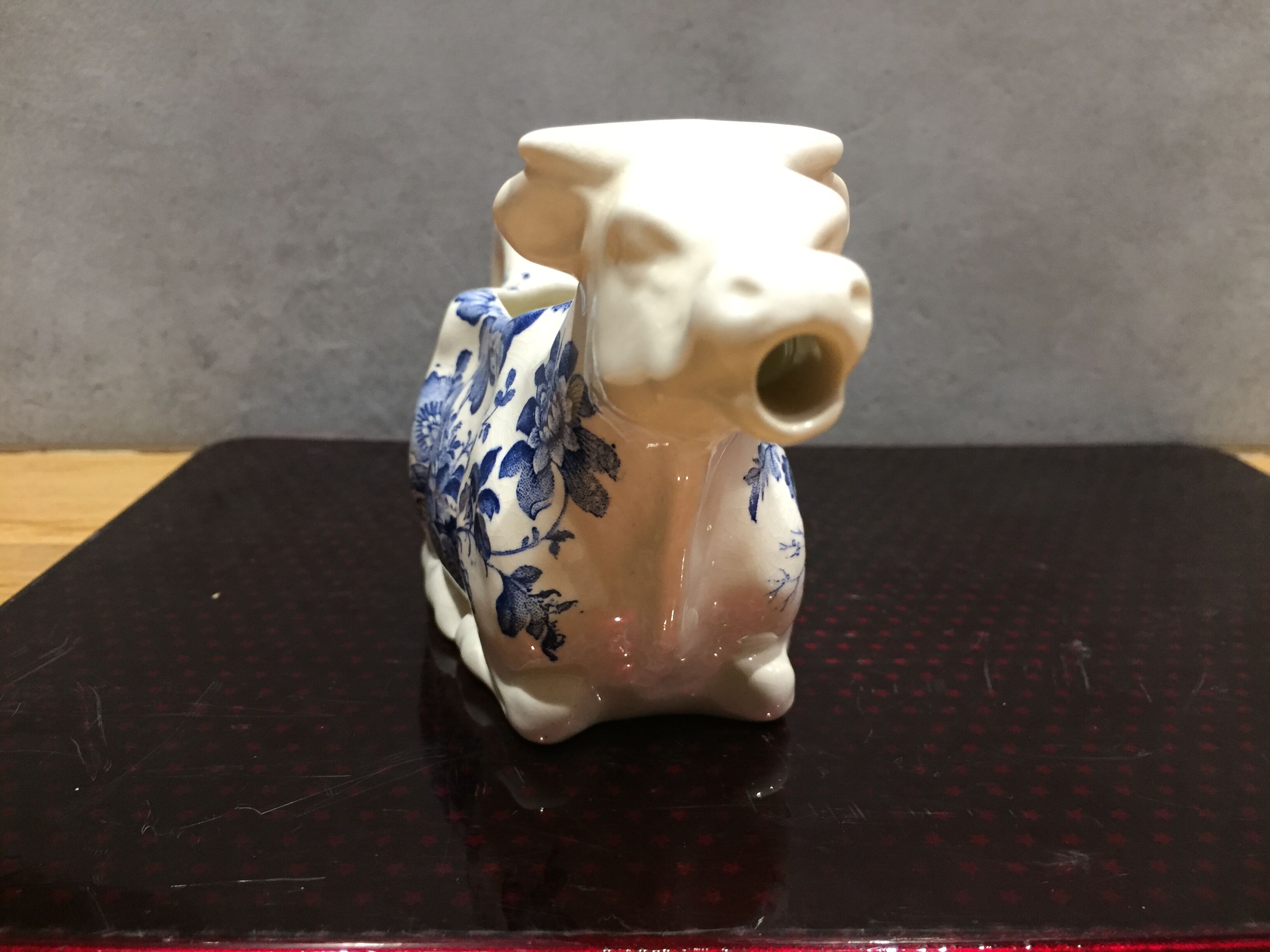 English porcelain cow-shaped sauce dish