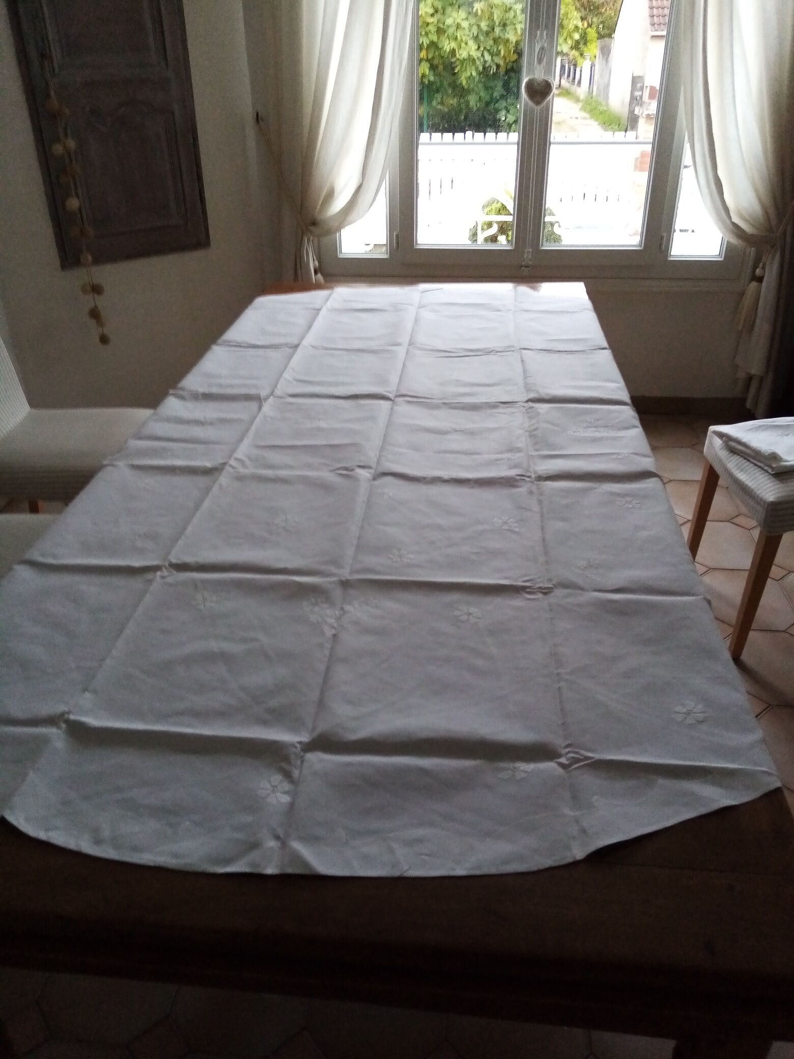 Antique white tablecloth embroidered with flowers and matching napkins